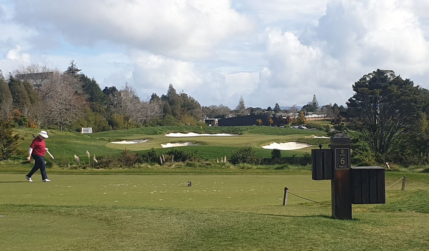 Golfer on the tee with bunkers ahead
